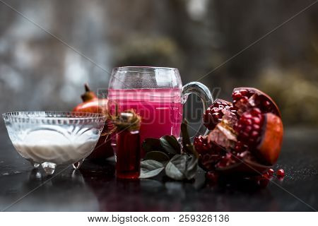 Close Up Of Pomegranate Shrbat Or Juice With Milk,pomegranate Essence,sugar And Raw Pomegranate On W