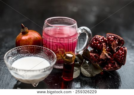 Close Up Of Pomegranate Shrbat Or Juice With Milk,pomegranate Essence,sugar And Raw Pomegranate On W