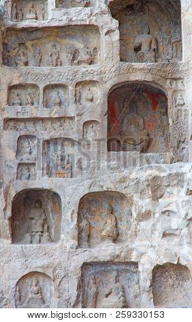 Famous Longmen Grottoes (statues of Buddha and Bodhisattvas carved in the monolith rock near Luoyang in Hennn province, China)