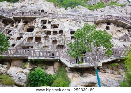 Famous Longmen Grottoes (statues of Buddha and Bodhisattvas carved in the monolith rock near Luoyang in Hennn province, China)