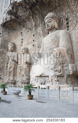 Famous Longmen Grottoes (statues of Buddha and Bodhisattvas carved in the monolith rock near Luoyang in Hennn province, China)