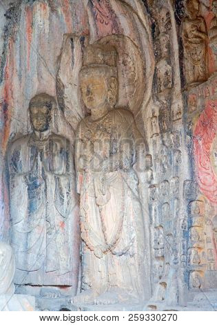 Famous Longmen Grottoes (statues of Buddha and Bodhisattvas carved in the monolith rock near Luoyang in Hennn province, China)