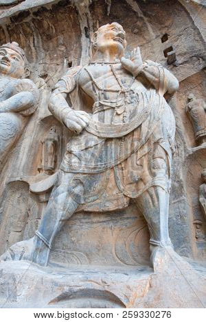 Famous Longmen Grottoes (statues of Buddha and Bodhisattvas carved in the monolith rock near Luoyang in Hennn province, China)
