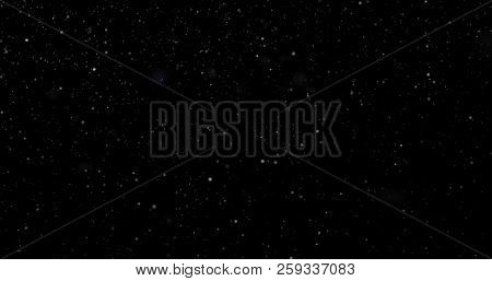 Flying Dust Particles On A Black Background