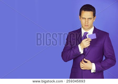 Businessman, Man Or Boss Holding Business Or Bank Card In Fashionable Violet Formal Suit, Shirt And 