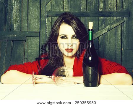 Sensual Elegant Attractive Young Woman With Long Lush Brunette Hair In Stylish Jacket With Wine Bott