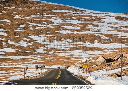 Trail Ridge Road, the highest (12,183 feet) continuous highway in the USA in high alpine tundra with rocks and mountains at autumn. Rocky Mountain National Park in Colorado, USA. 