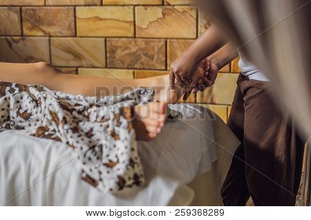 Total Relaxation. Beautiful Young Wwoman Get Balinese Or Thai Massage