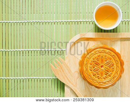 Mooncake On A Wooden Plate For Mid-autumn Festival Or Mooncake Festival