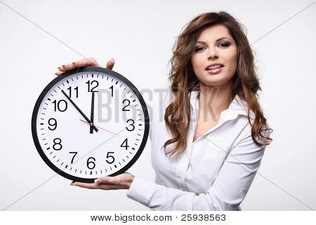 Beautiful smiling woman holding big clock.