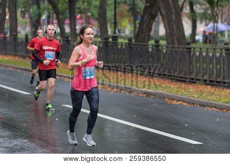 Dnipro, Ukraine - September 16, 2018: Group Of Men Following Woman During 21 Km Distance Of Atb Dnip