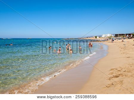 Malia. Crete, Greece - July 1, 2018: People Are Resting On A Sunny Day At The Beach In Malia, Crete,