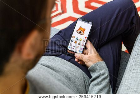 London, Uk - Sep 21, 2018: Man Using The New Astonished Fox Ar Memoji Emoji Face On Apple Iphone Xs 