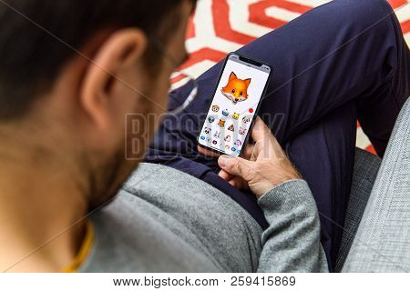 London, Uk - Sep 21, 2018: Man Using The New Cute Fox Ar Memoji Emoji Face On Apple Iphone Xs With T