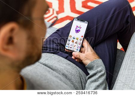 London, Uk - Sep 21, 2018: Man Using The New Ar Memoji Emoji On Apple Iphone Xs With The Immense Ole
