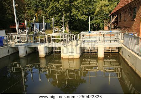 Weir Dam Of The Old Historic Watermill In The Fog Valley Near Güstrow