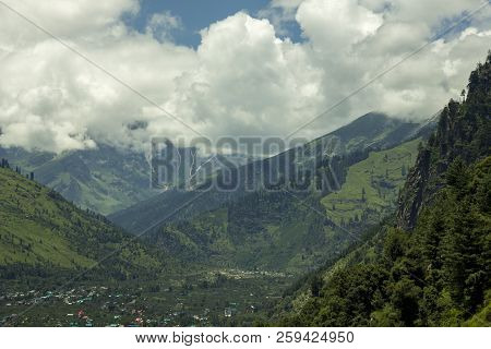 Town In A Mountain Valley And Sky