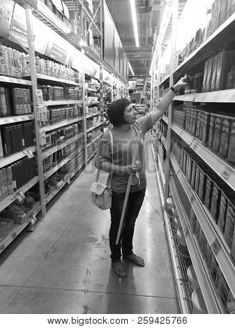 09 09 2018 Russia, Bryansk, Hypermarket. A Woman Chooses Goods For Repair.