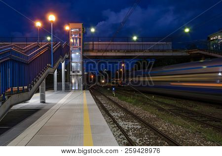 Kolobrzeg, West Pomeranian / Poland - 2018:platform Of The Railway Station With A Pedestrian Bridge 