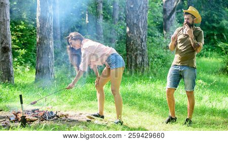 Girl Sexy Buttocks Denim Shorts Roasting Sausage At Bonfire. Man Bearded Hipster Looks At Sexy Femal