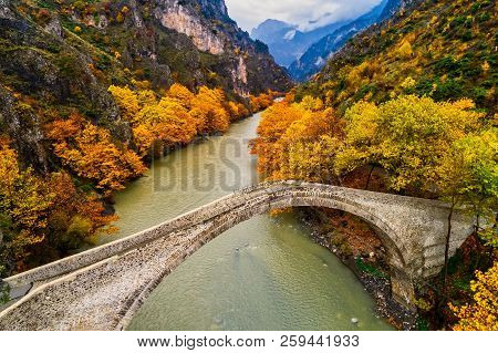 Aerial View Of Konitsa Old Bridge And Aoos River An Autumn Day, Greece.
