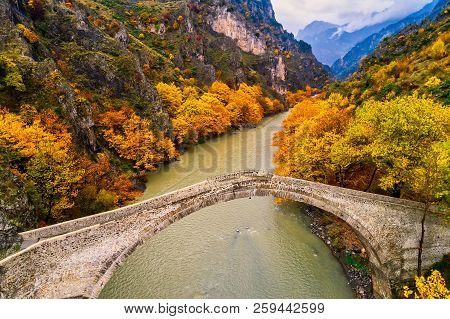 Aerial View Of Konitsa Old Bridge And Aoos River An Autumn Day, Greece.