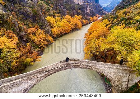Aerial View Of Konitsa Old Bridge And Aoos River An Autumn Day, Greece.