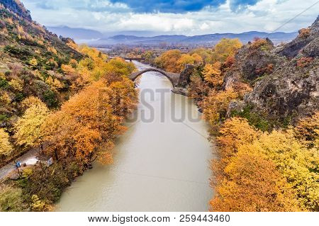 Aerial View Of Konitsa Old Bridge And Aoos River An Autumn Day, Greece.