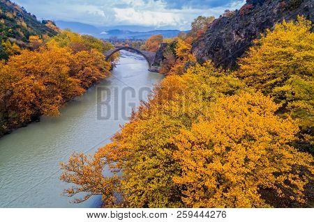 Aerial View Of Konitsa Old Bridge And Aoos River An Autumn Day, Greece.