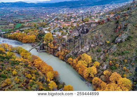 Aerial View Of Konitsa Old Bridge And Aoos River An Autumn Day, Greece.