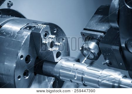 The Cnc Lathe Machine Cutting  The Groove Slot At The Steel Shaft By Milling Spindle .hi-technology 