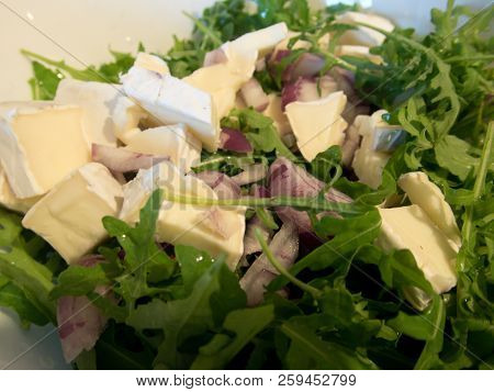 Camembert Cheese And Red Onion Prepared For A Salad