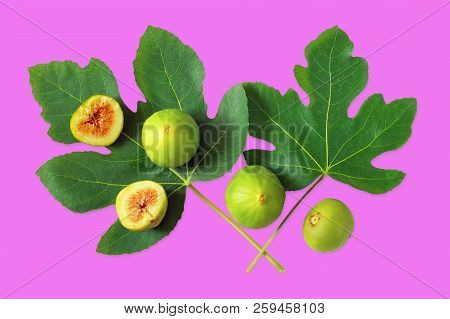 Ripe Fig Fruits And Green Leaves Of A Fig Tree On Reddish-purple Background.  Flat Lay, Isolated