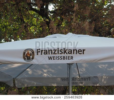 Berlin, Germany - Circa September 2018: Franziskaner Weissbier (meaning White Beer) On Sun Umbrella