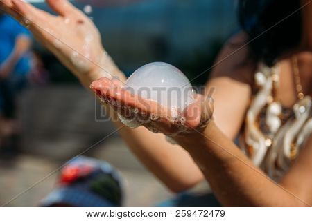 On The Hand Of The Girl A Bubble Of Dry Ice, Nitrogen. Nitrogen Scientific Experiments And Show, Sho