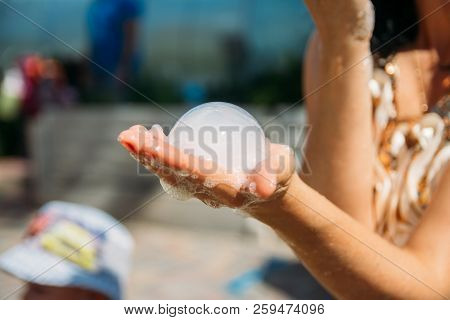 On The Hand Of The Girl A Bubble Of Dry Ice, Nitrogen. Nitrogen Scientific Experiments And Show, Sho