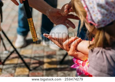 On The Hand Of The Girl A Bubble Of Dry Ice, Nitrogen. Nitrogen Scientific Experiments And Show, Sho