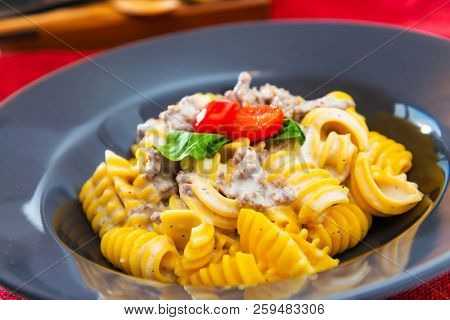 Radiatori pasta in a creamy tomato parmesan cheese sauce