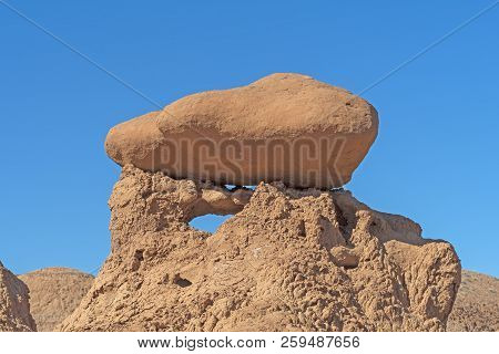 Eroded Boulder On Crumbling Siltstone In Goblin Valley State Park In Utah
