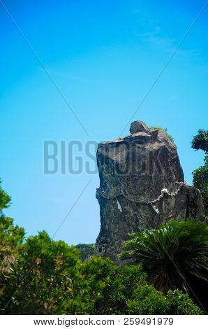 Dog Rock At The Udo Jingu - Shinto Shrine Located In Miyazaki, Japan. This Rock Looks Like A Dog Wat
