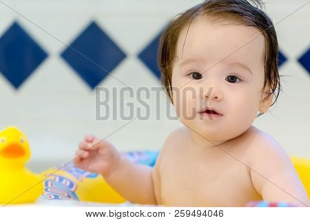 Baby Boy Taking A Bath In A Big Bath Tub