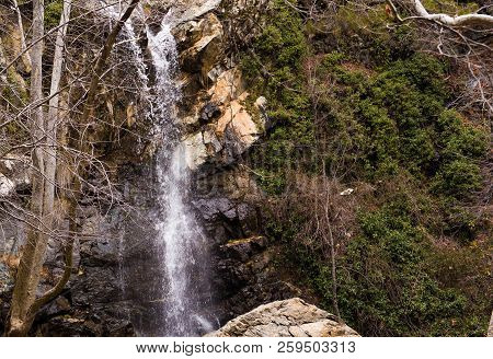 Autumn Waterfall With Rocks And Leaves In Troodos Mountains In Cyprus