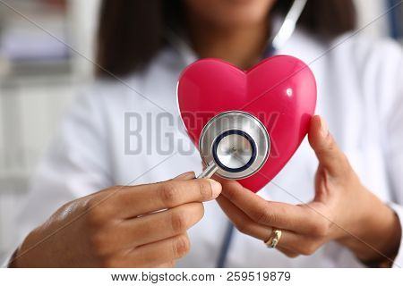 Beautiful Black Smiling Female Doctor Hold In Arms Red Toy Heart Closeup. Cardio Therapeutist Studen