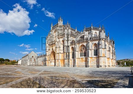 Batalha, Portugal. Monastery of Batalha aka Santa Maria da Vitoria Abbey. Facade with Portal in Gothic and Manuelino aka Manueline style