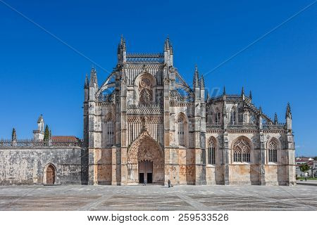 Batalha, Portugal. Monastery of Batalha aka Santa Maria da Vitoria Abbey. Facade with Portal in Gothic and Manuelino aka Manueline style