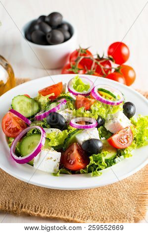 Fresh Greek Salad Made Of Cherry Tomato, Ruccola, Arugula, Feta, Olives, Cucumbers, Onion And Spices