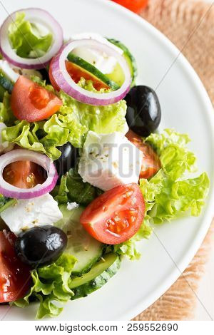 Fresh Greek Salad Made Of Cherry Tomato, Ruccola, Arugula, Feta, Olives, Cucumbers, Onion And Spices