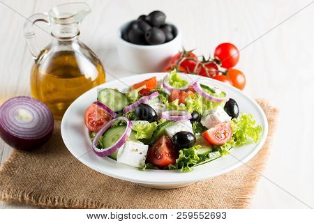 Fresh Greek Salad Made Of Cherry Tomato, Ruccola, Arugula, Feta, Olives, Cucumbers, Onion And Spices