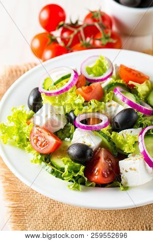 Fresh Greek Salad Made Of Cherry Tomato, Ruccola, Arugula, Feta, Olives, Cucumbers, Onion And Spices