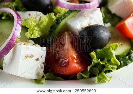 Fresh Greek Salad Made Of Cherry Tomato, Ruccola, Arugula, Feta, Olives, Cucumbers, Onion And Spices